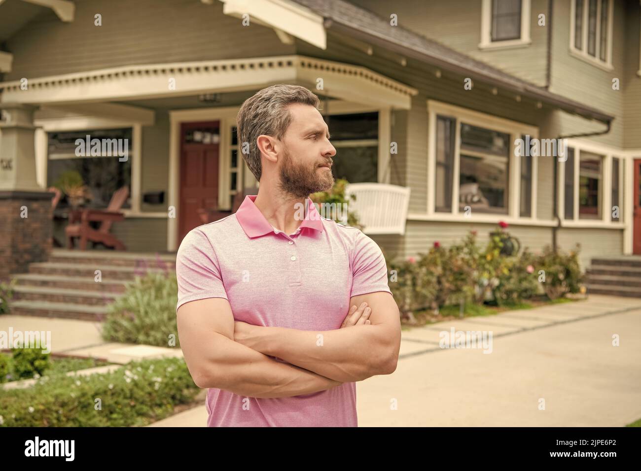 real estate agent sell property. realtor in suburb neighborhood. man purchasing house Stock Photo