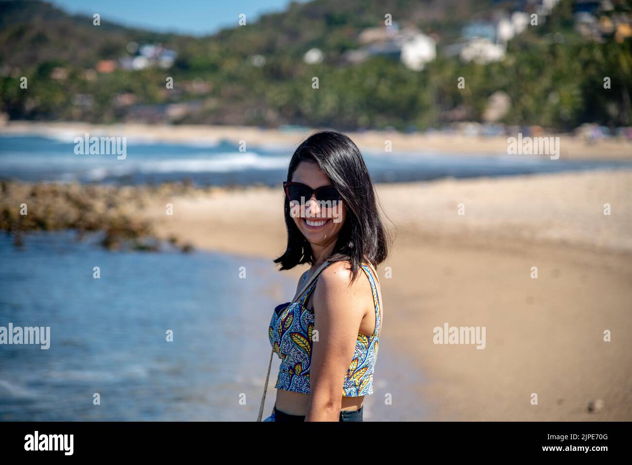 A woman posing for a photo on a beach in Sayulita, Mexico Stock Photo