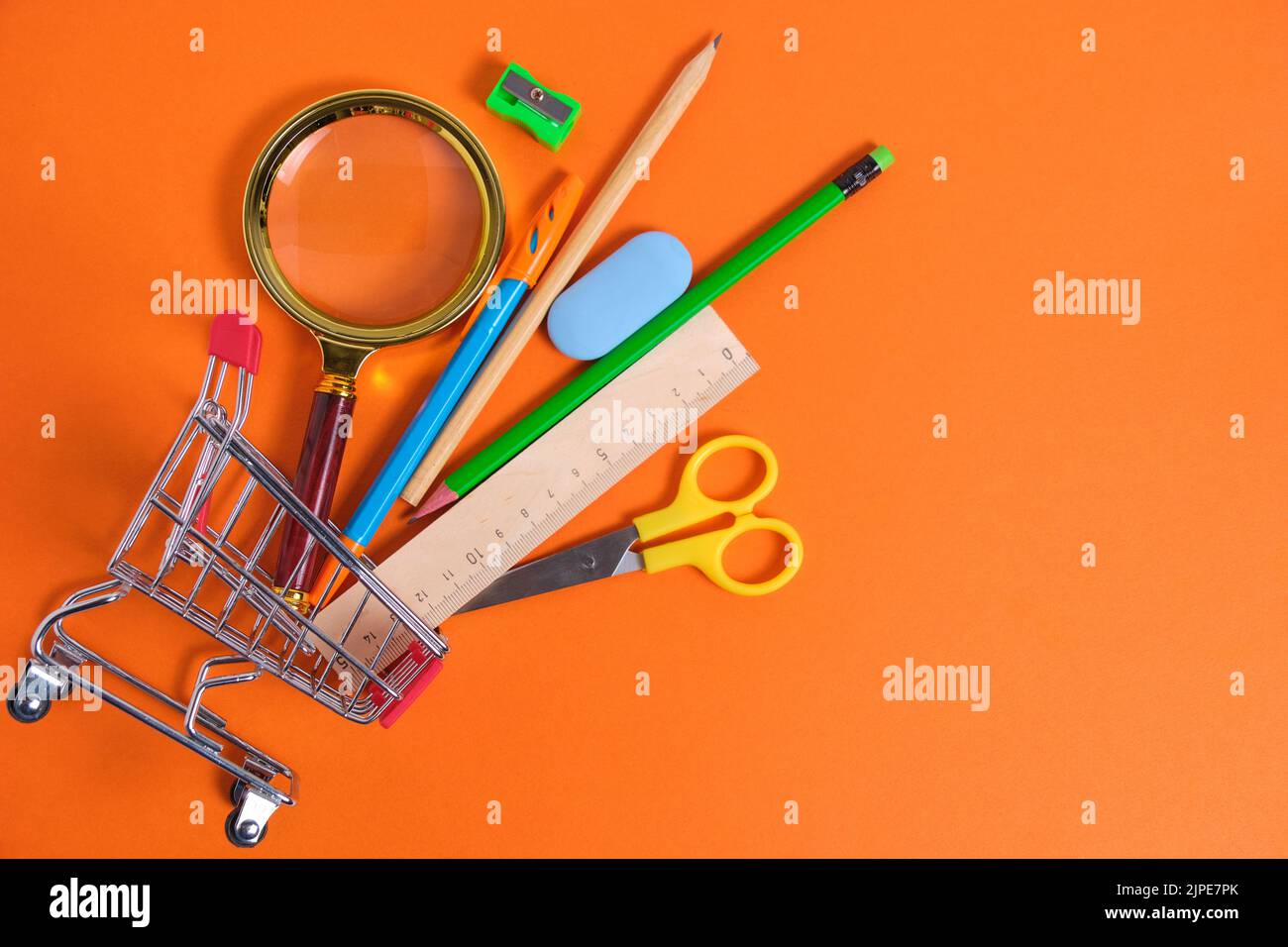 Shopping basket with office and school supplies.Concept preparing for