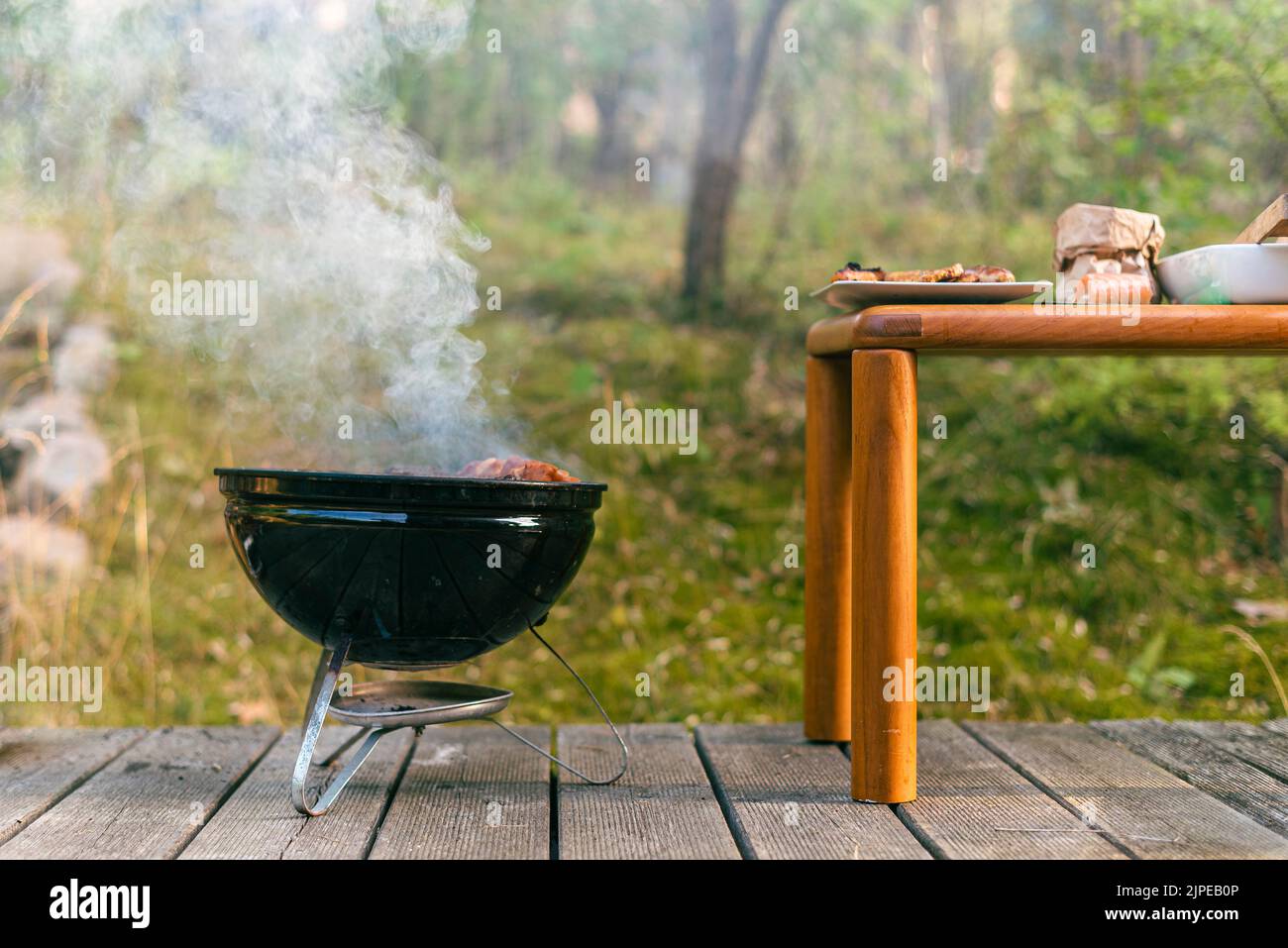Grilling meat on charcoal grill hi-res stock photography and images - Alamy