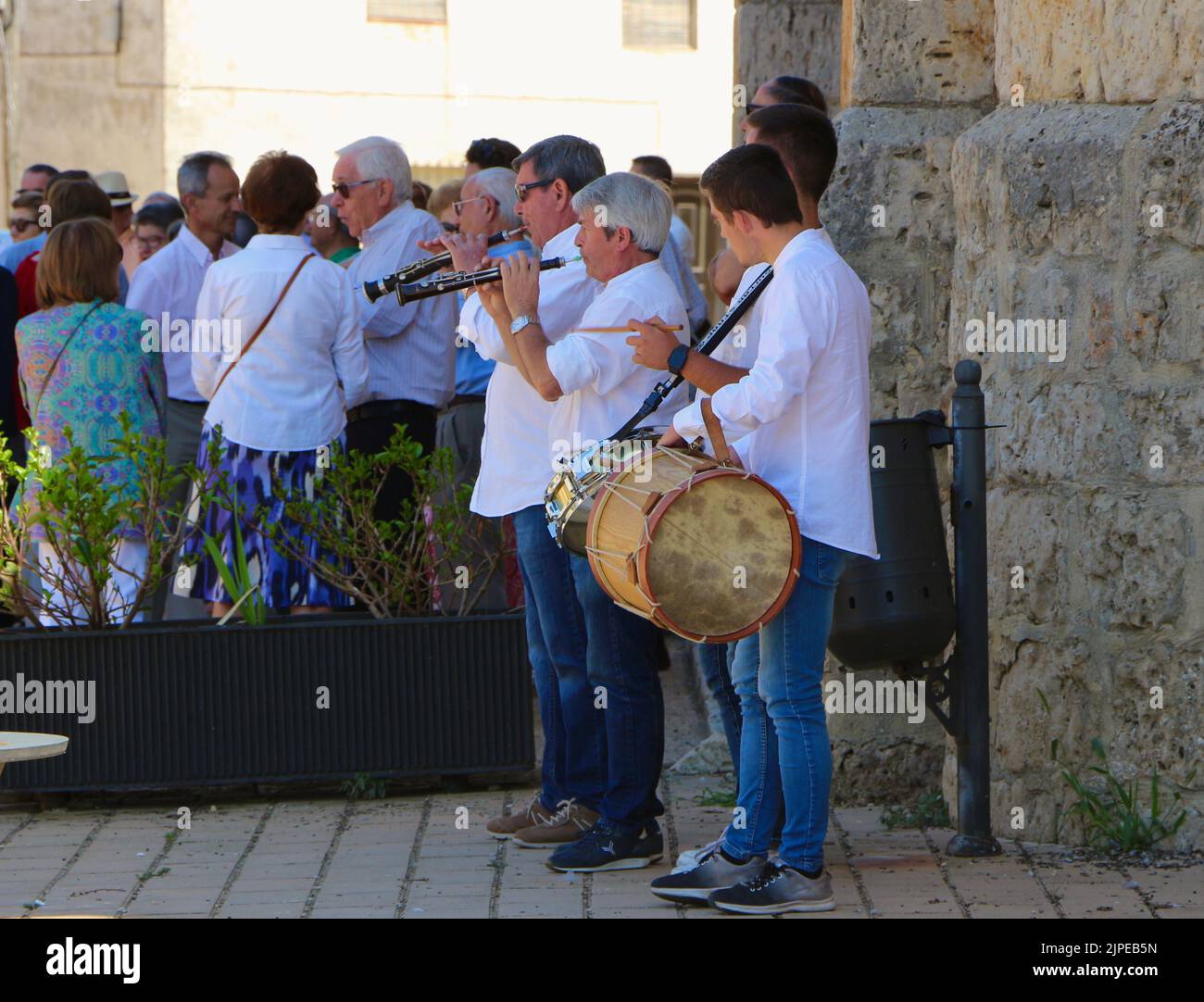 Four piece band playing outside the church during celebrations for the Assumption of the Virgin Mary 15 August 2022 Lantadilla Palencia Spain Stock Photo