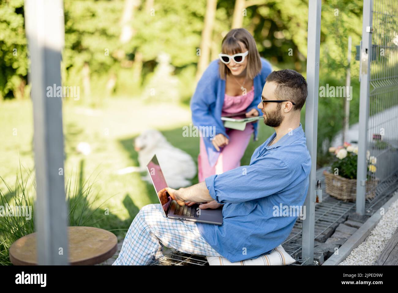 Couple work on laptop computer on nature Stock Photo