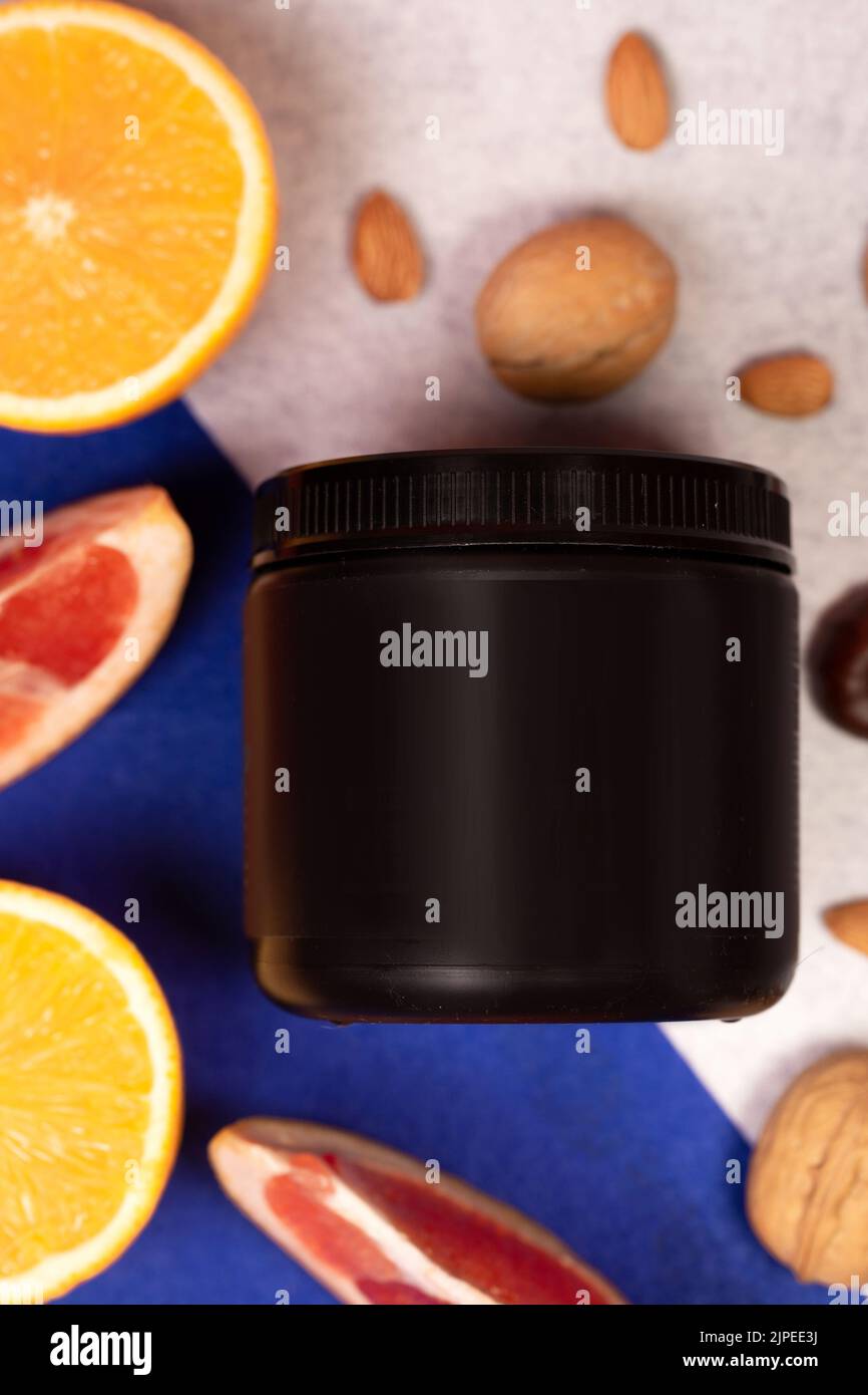 black plastic jar without logo and fruit. Stock Photo