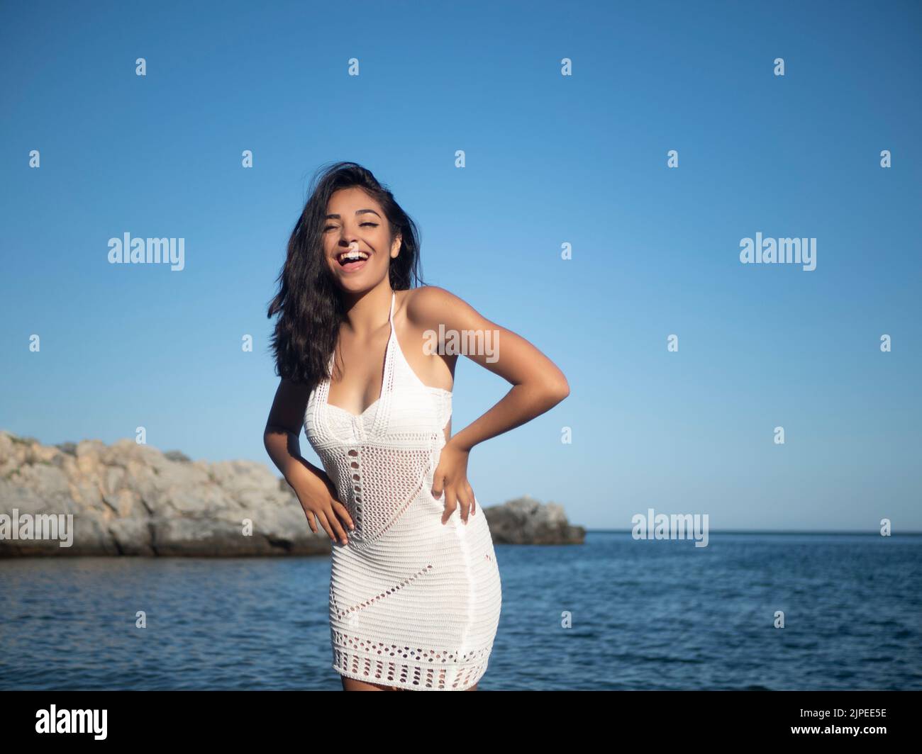 Long black hair blue dress hi-res stock photography and images - Alamy