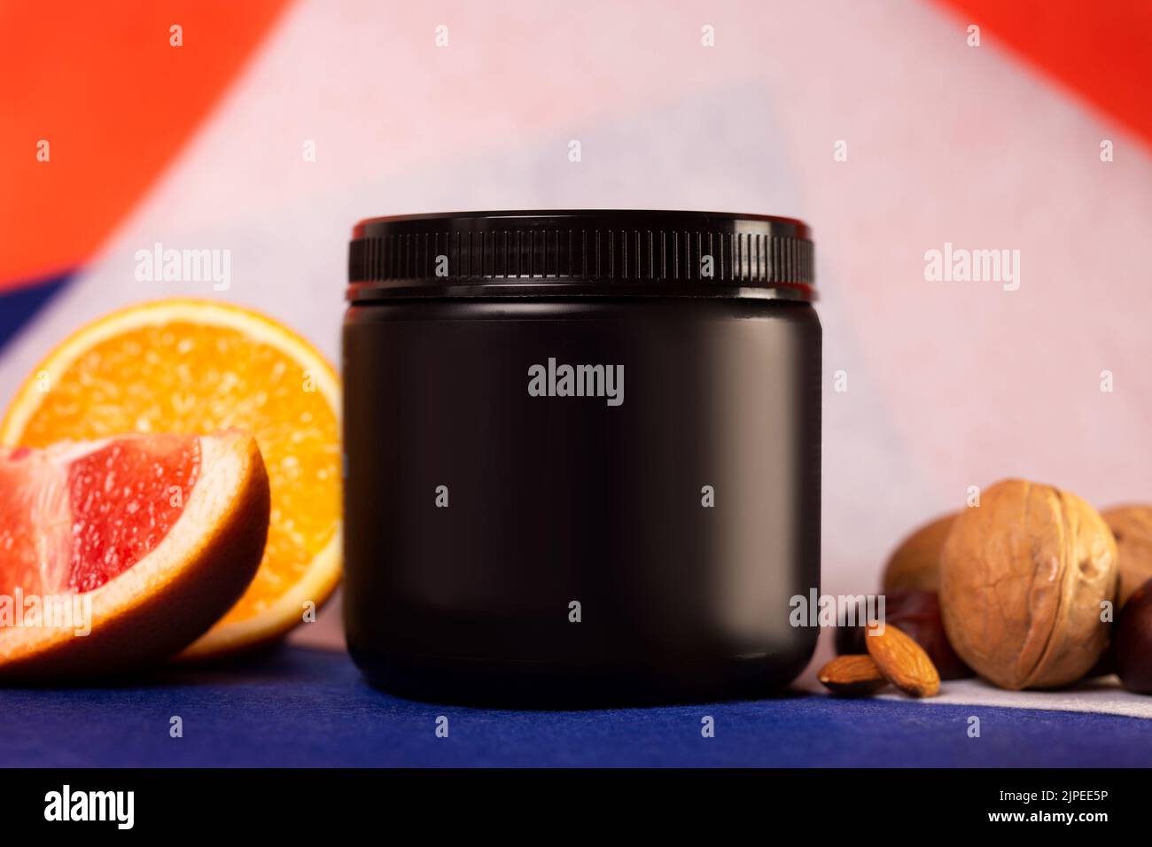 black plastic jar without logo and fruit. Stock Photo