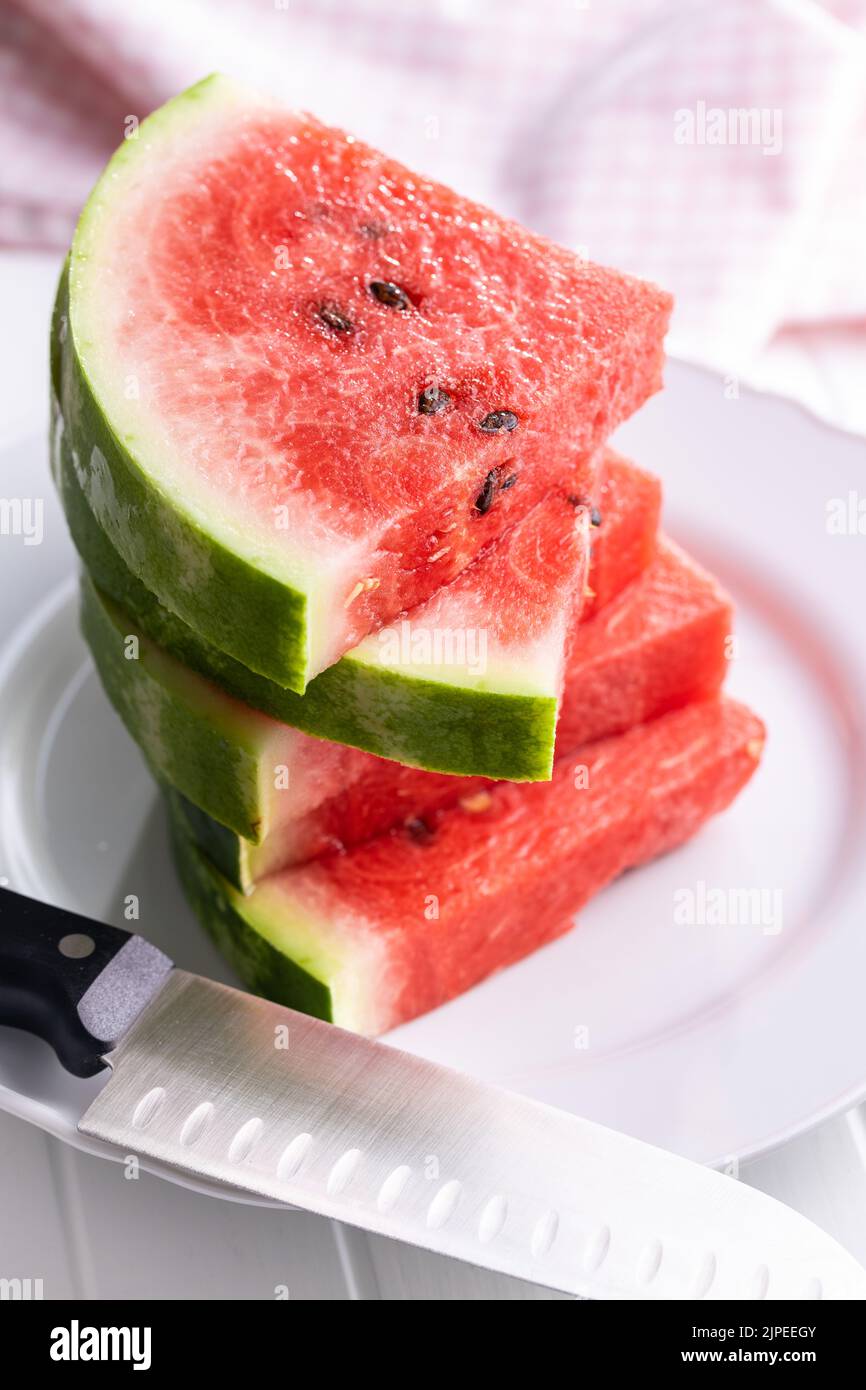 Slices of red watermelon on a plate. Stock Photo