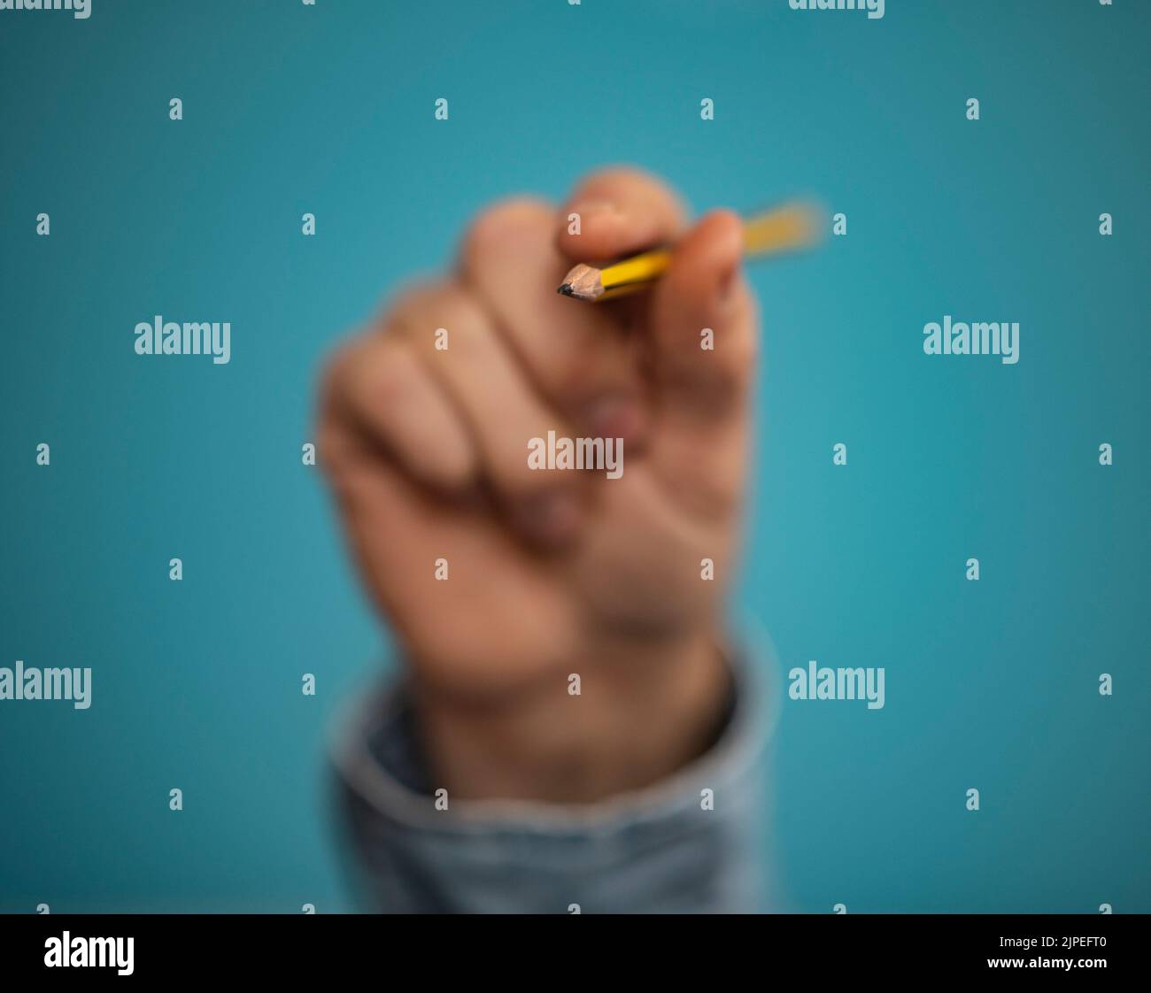 Using Pencil Hand Hand holding pencils hi-res stock photography and images - Alamy