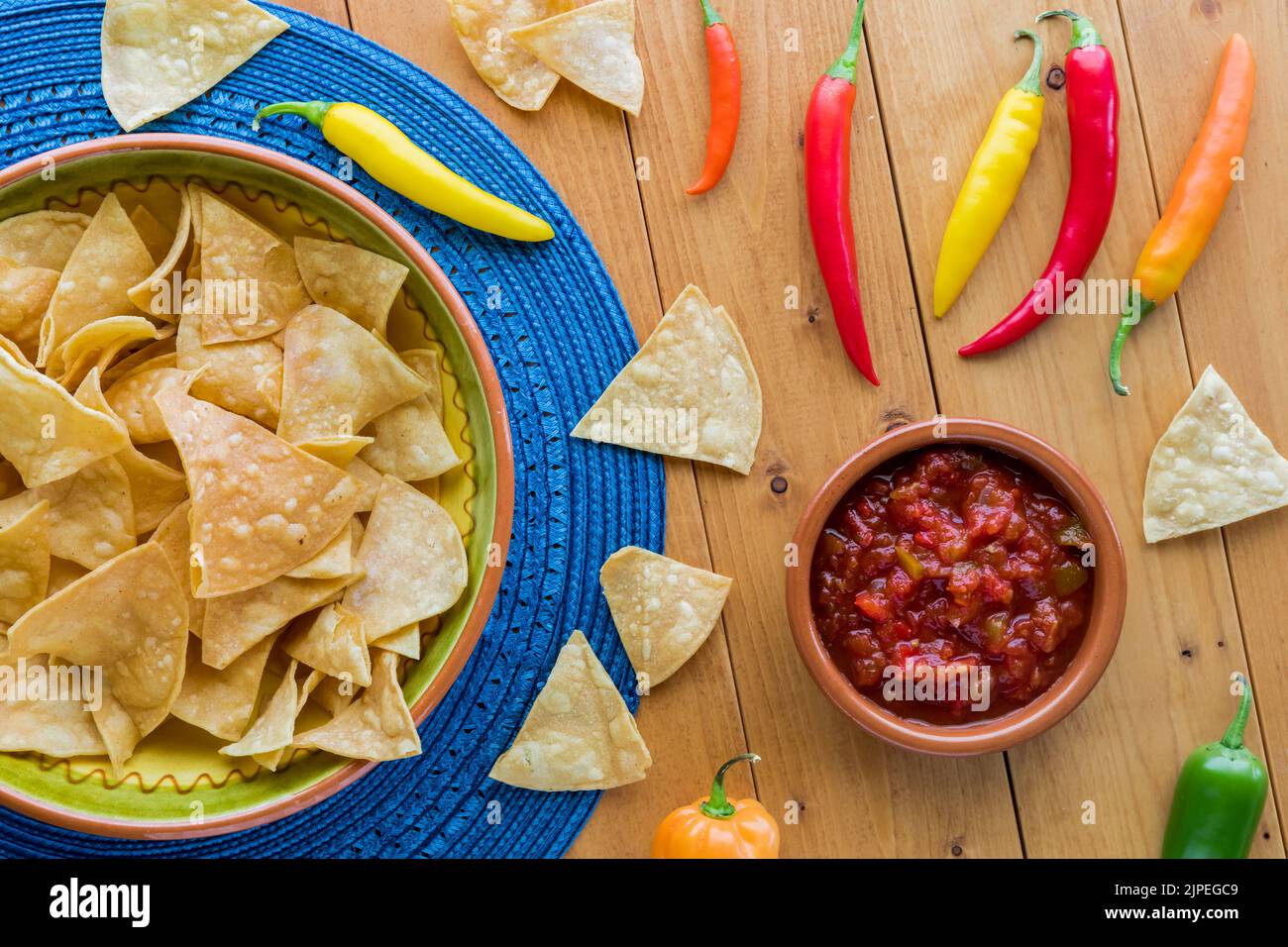 A large bowl of tortilla chips served with gourmet salsa Stock Photo