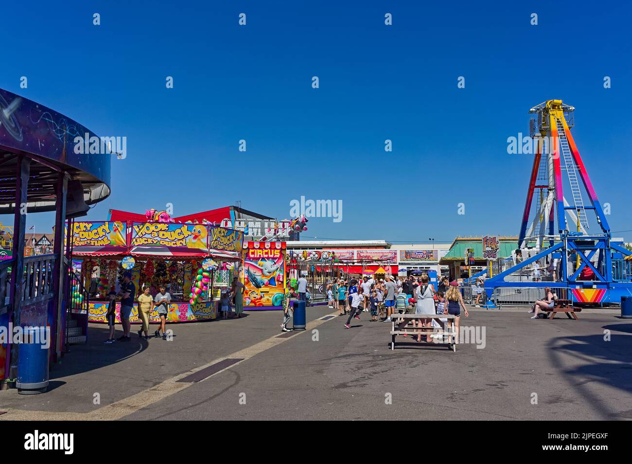People enjoying the amusements at the seafront funfair in Skegness Stock Photo
