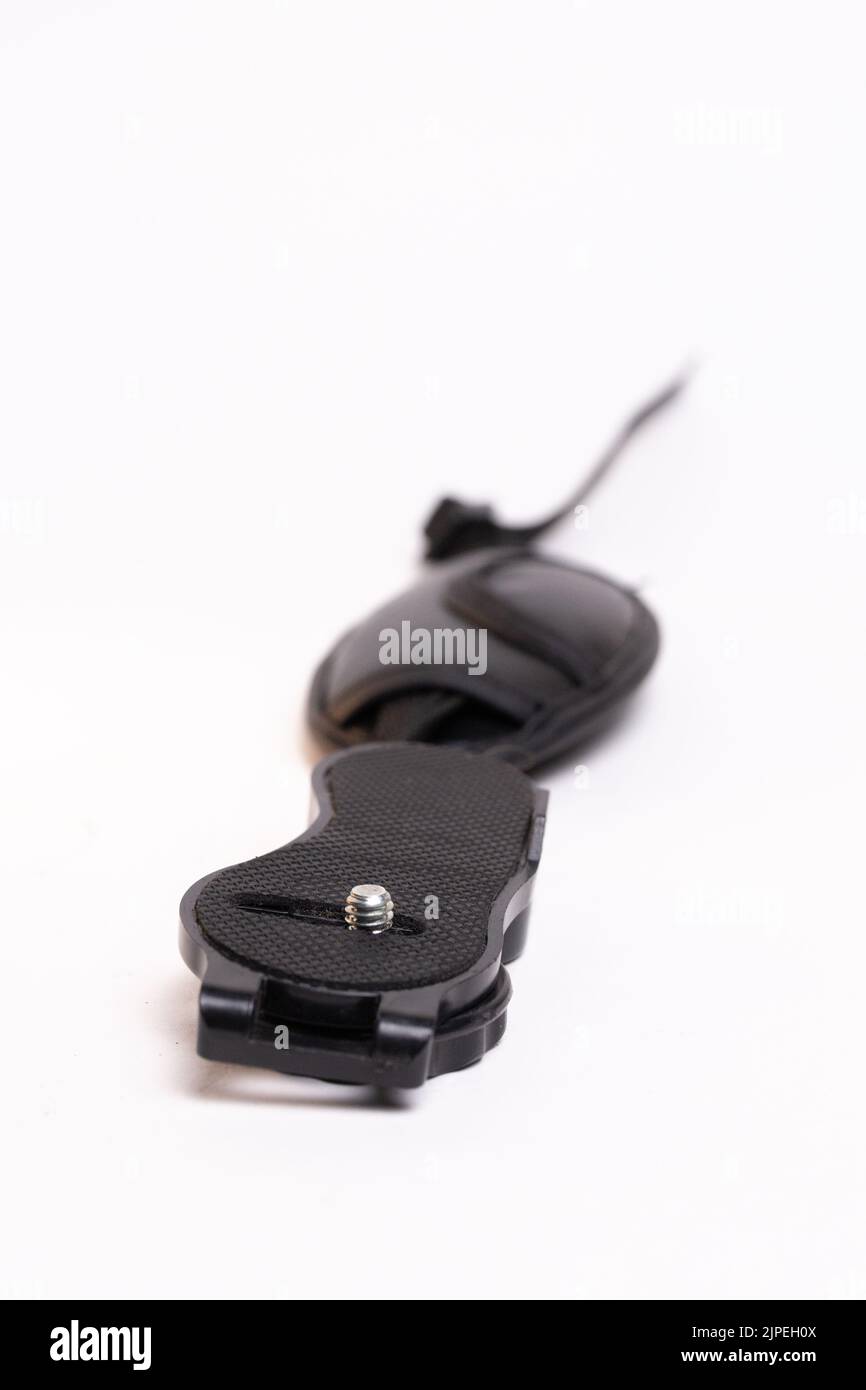 black leather camera strap on white background. Stock Photo