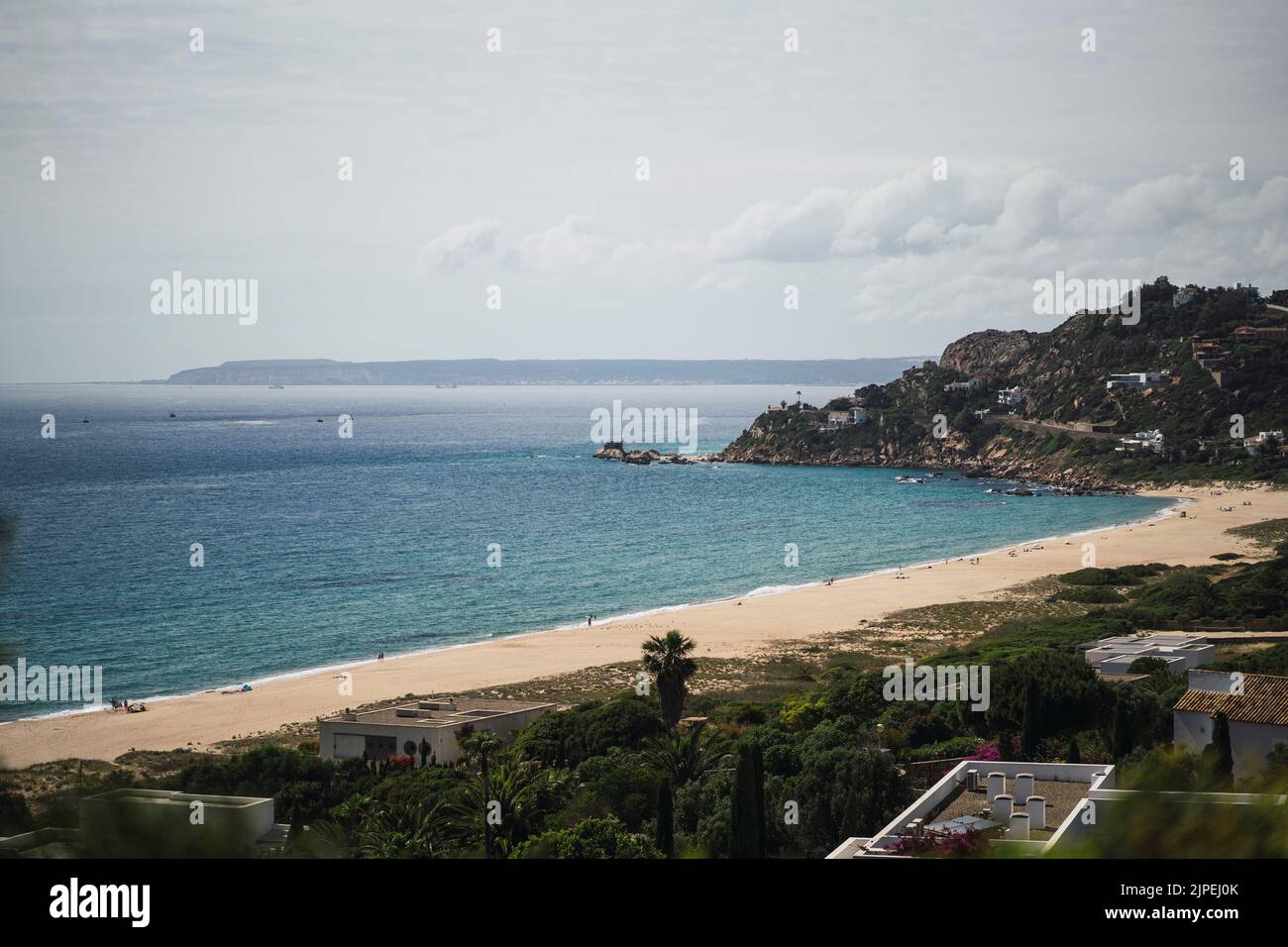 A beautiful shot of people relaxing on Bolonia beach in Tarifa, Spain Stock Photo