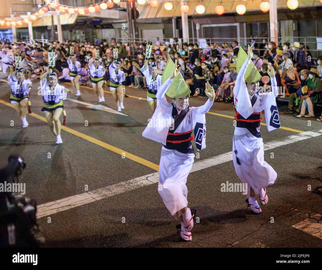 Tokushima, Japan - August 12, 2022: Performers dance down street at Awaodori festival Stock Photo