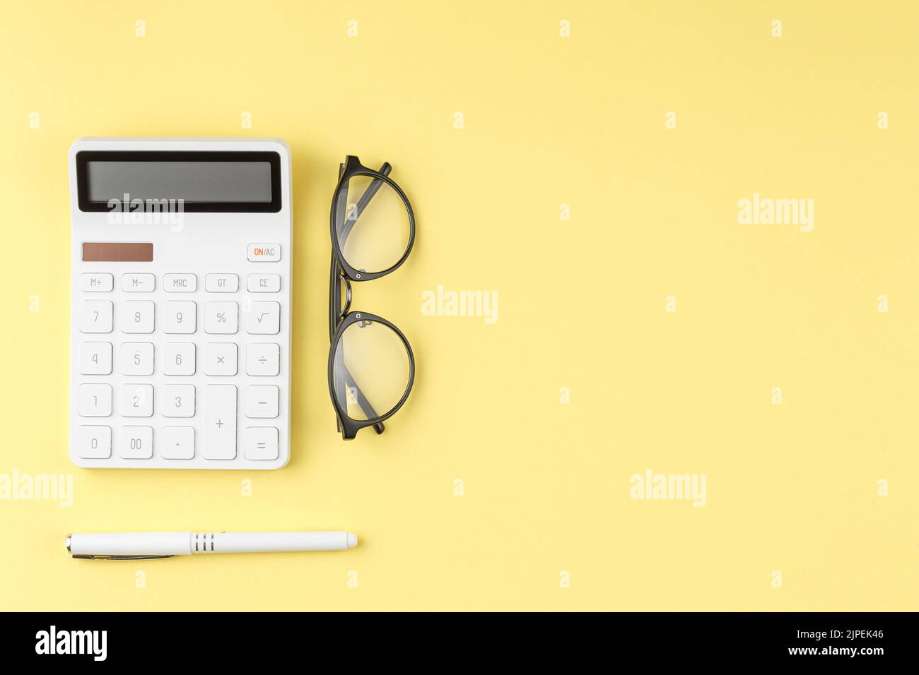 Glasses calculator and pen top view. Stock Photo