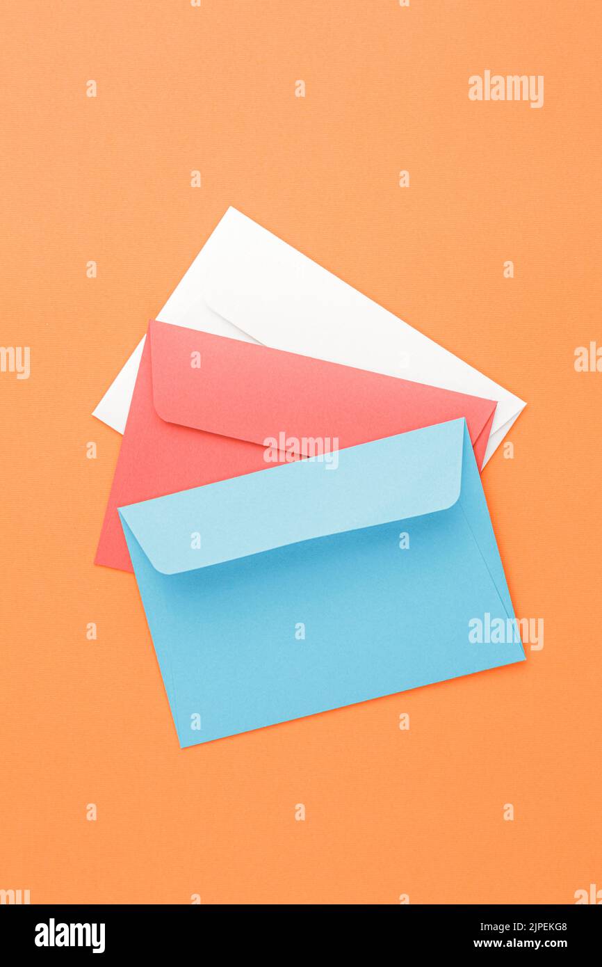 Multicolored paper postal envelopes. Top view Stock Photo