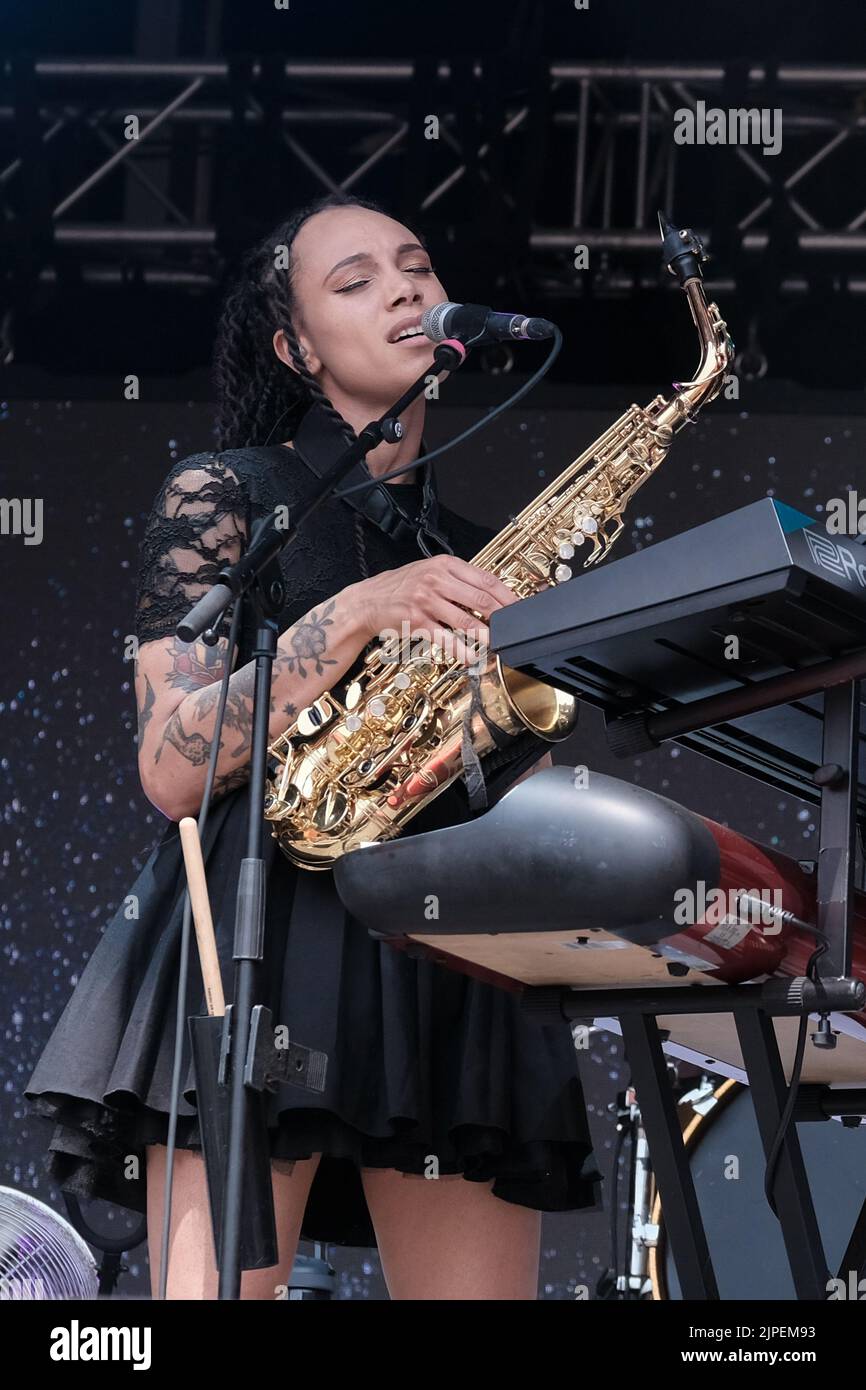 Winchester, UK. 14th Aug, 2022. Marcia Richards, female vocalist, alto saxophone and melodica player with British reggae punk band The Skints seen performing live on the Grand Central stage during the Fair Festival. Boomtown is a British music festival held every year on the Matterley Estate in South Downs National Park, near Winchester. Credit: SOPA Images Limited/Alamy Live News Stock Photo