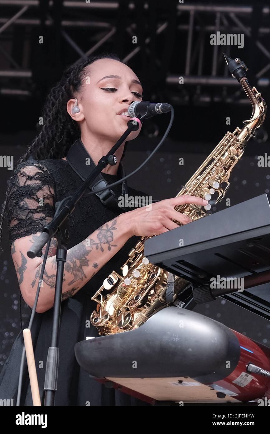 Marcia Richards, female vocalist, alto saxophone and melodica player with British reggae punk band The Skints seen performing live on the Grand Central stage during the Fair Festival. Boomtown is a British music festival held every year on the Matterley Estate in South Downs National Park, near Winchester. (Photo by Dawn Fletcher-Park / SOPA Images/Sipa USA) Stock Photo