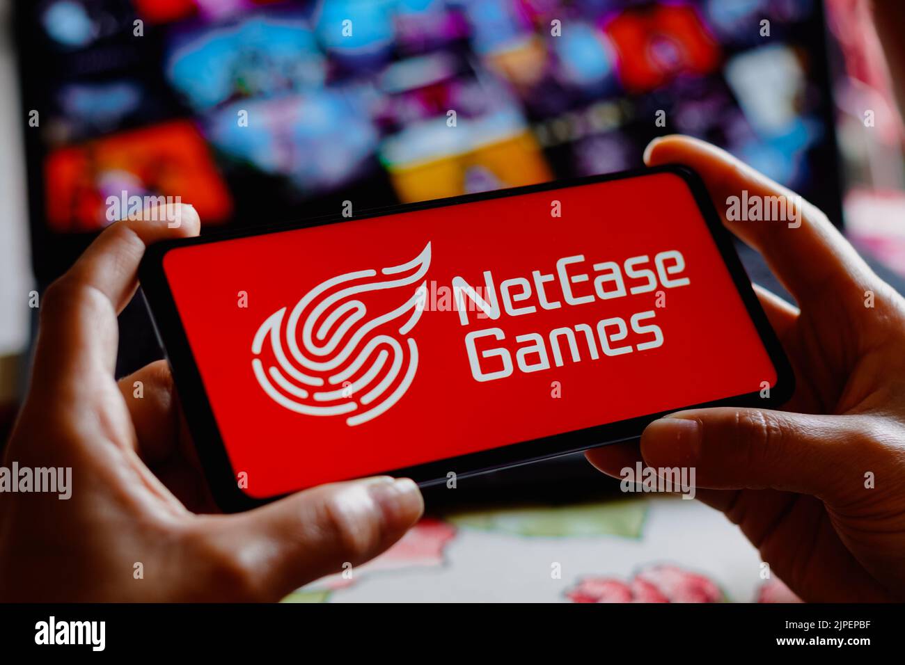In this photo illustration, the NetEase Games logo is displayed on a smartphone screen. Stock Photo