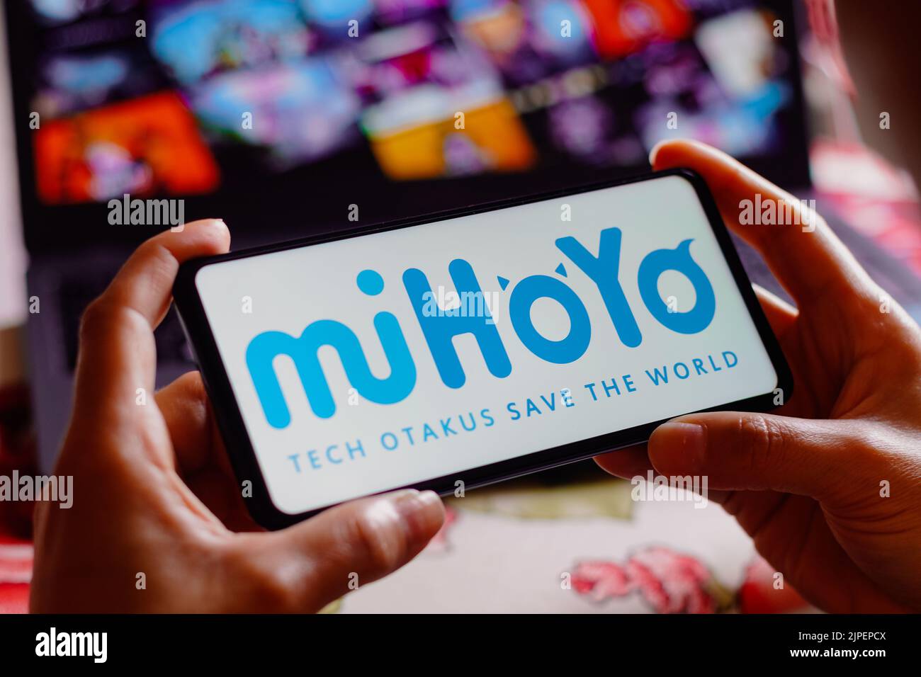 In this photo illustration, the Mihoyo logo is displayed on a smartphone screen. Stock Photo