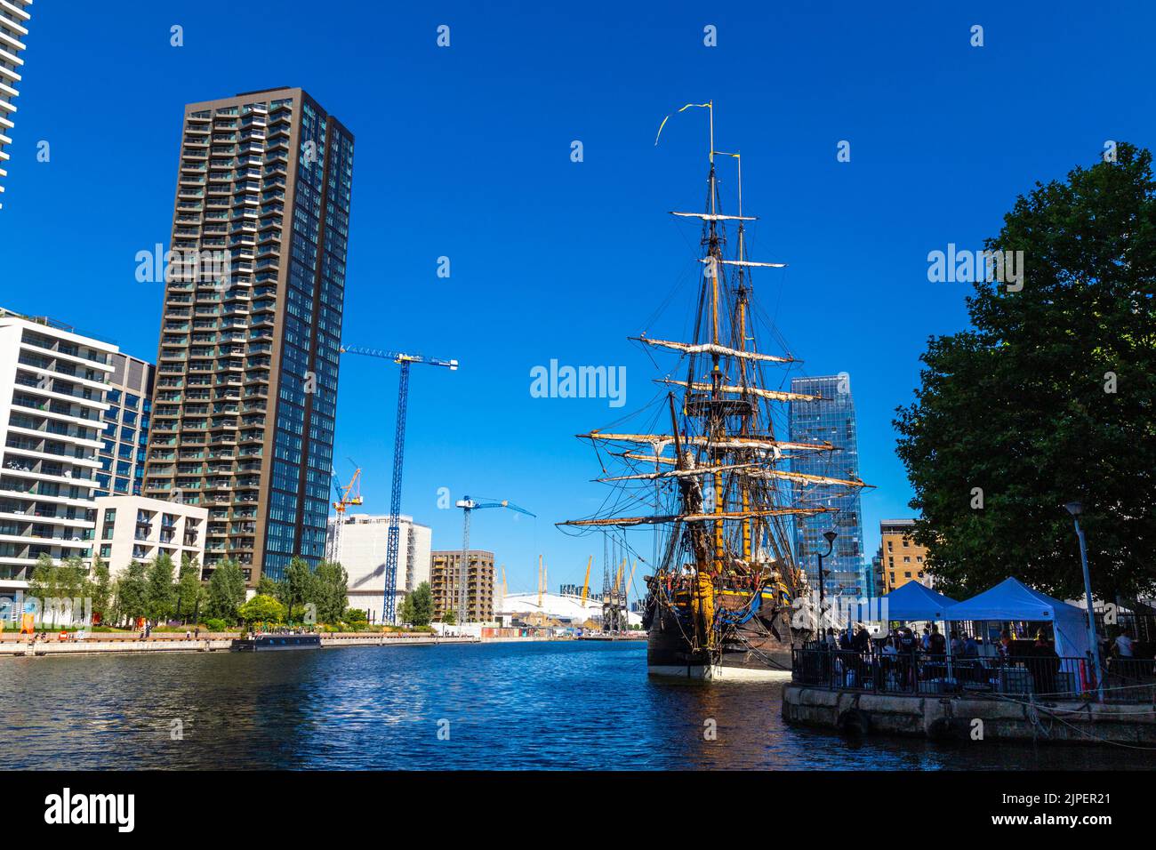10 August 2022, London, UK - Götheborg of Sweden, largest wooden ocean-sailing ship docked in Canary Wharf South Dock on it's journey to Asia Stock Photo