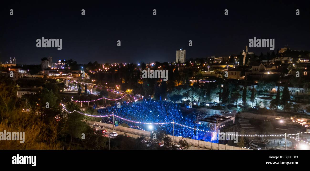 Israelis attend a musical performance at the Sultan's Pool outside the Old City walls in Jerusalem Israel Stock Photo