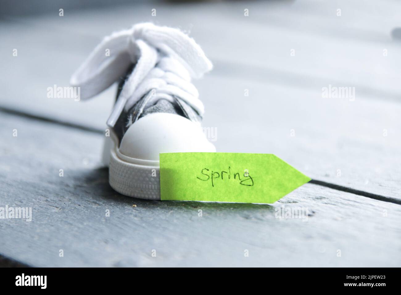creative concept, green pointer with the inscription spring Stock Photo