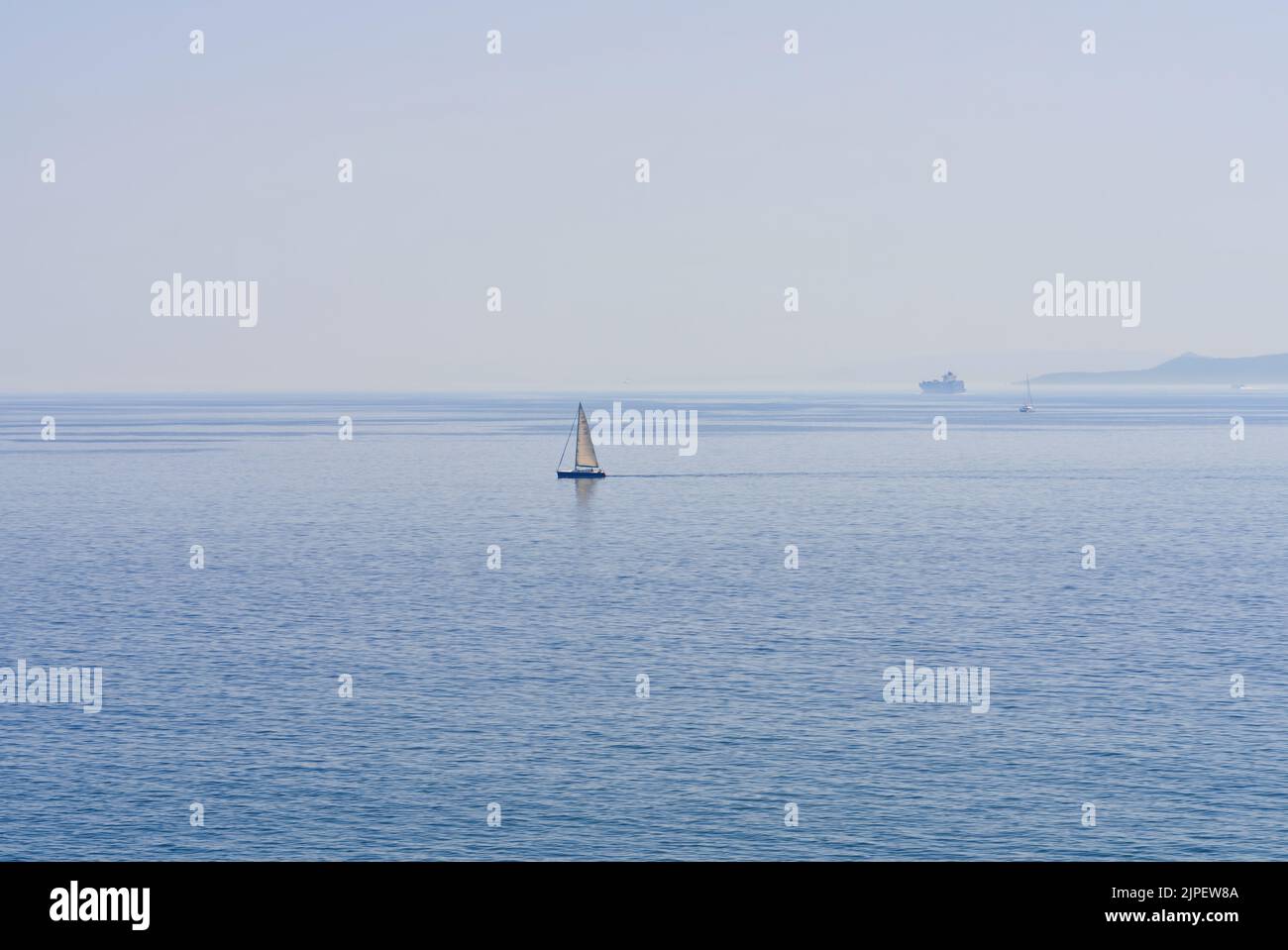 Lonely sailboat hi-res stock photography and images - Alamy