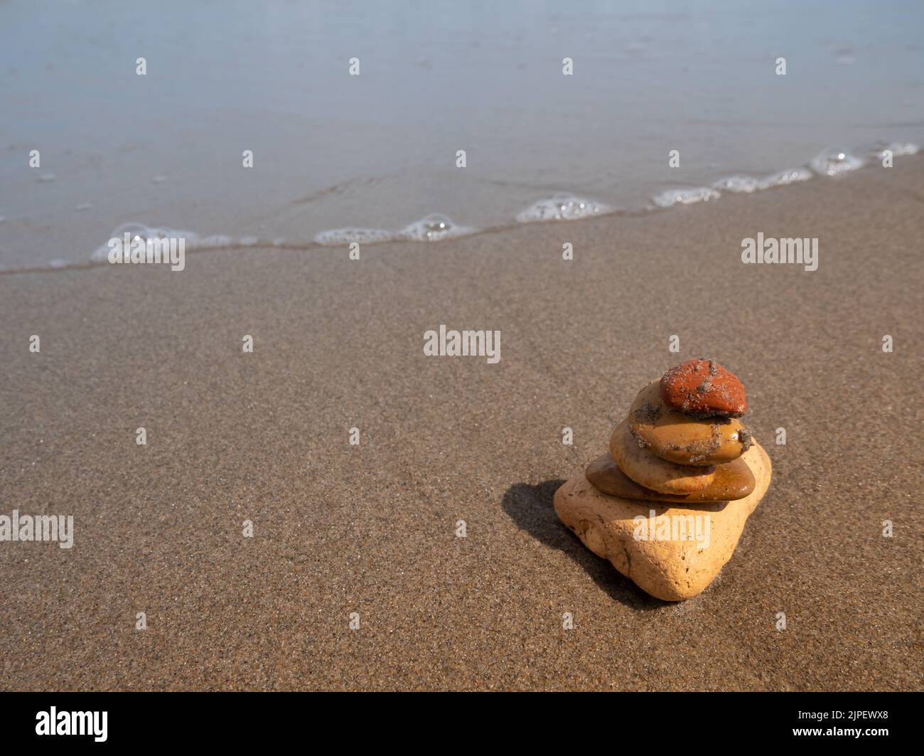 Zen stones on a beach Stock Photo