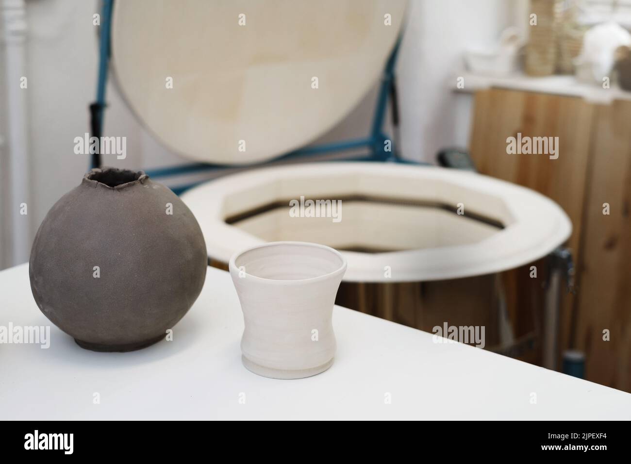 closeup of vases near kiln, oven for roasting of unbaked clay handmade
