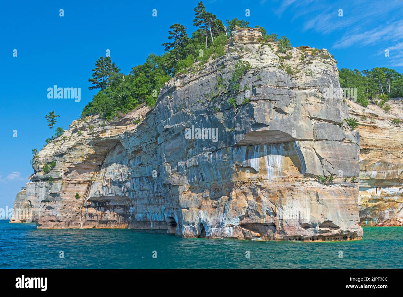 Soaring Cliffs on a Picturesque Lakeshore on Lake Superior in Pictured Rocks National Lakeshore in Michigan Stock Photo