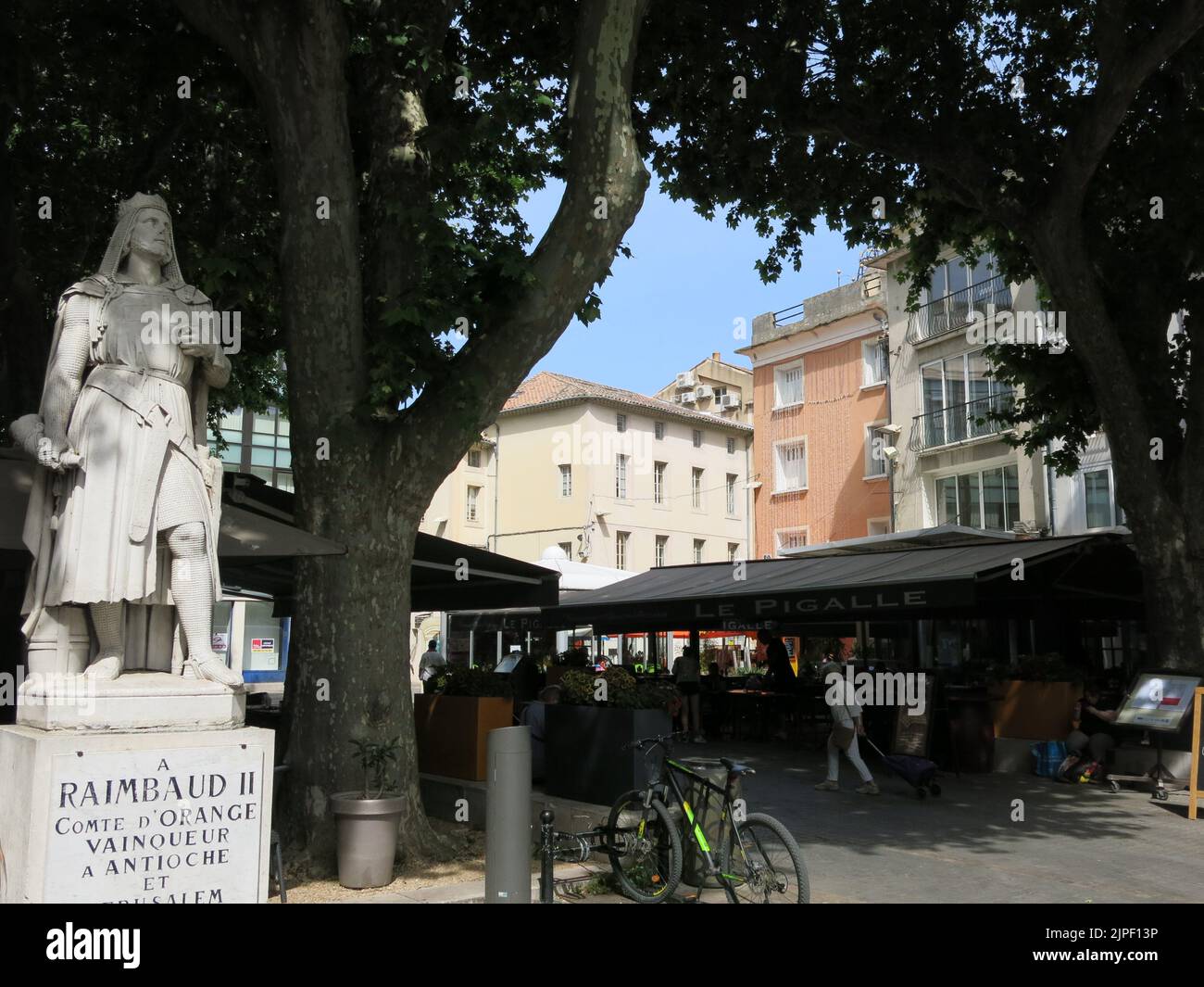 Erected in the town's main square in 1846, the marble statue of Raimbaud II is the 11th century Count of Orange, associated with the Crusades. Stock Photo