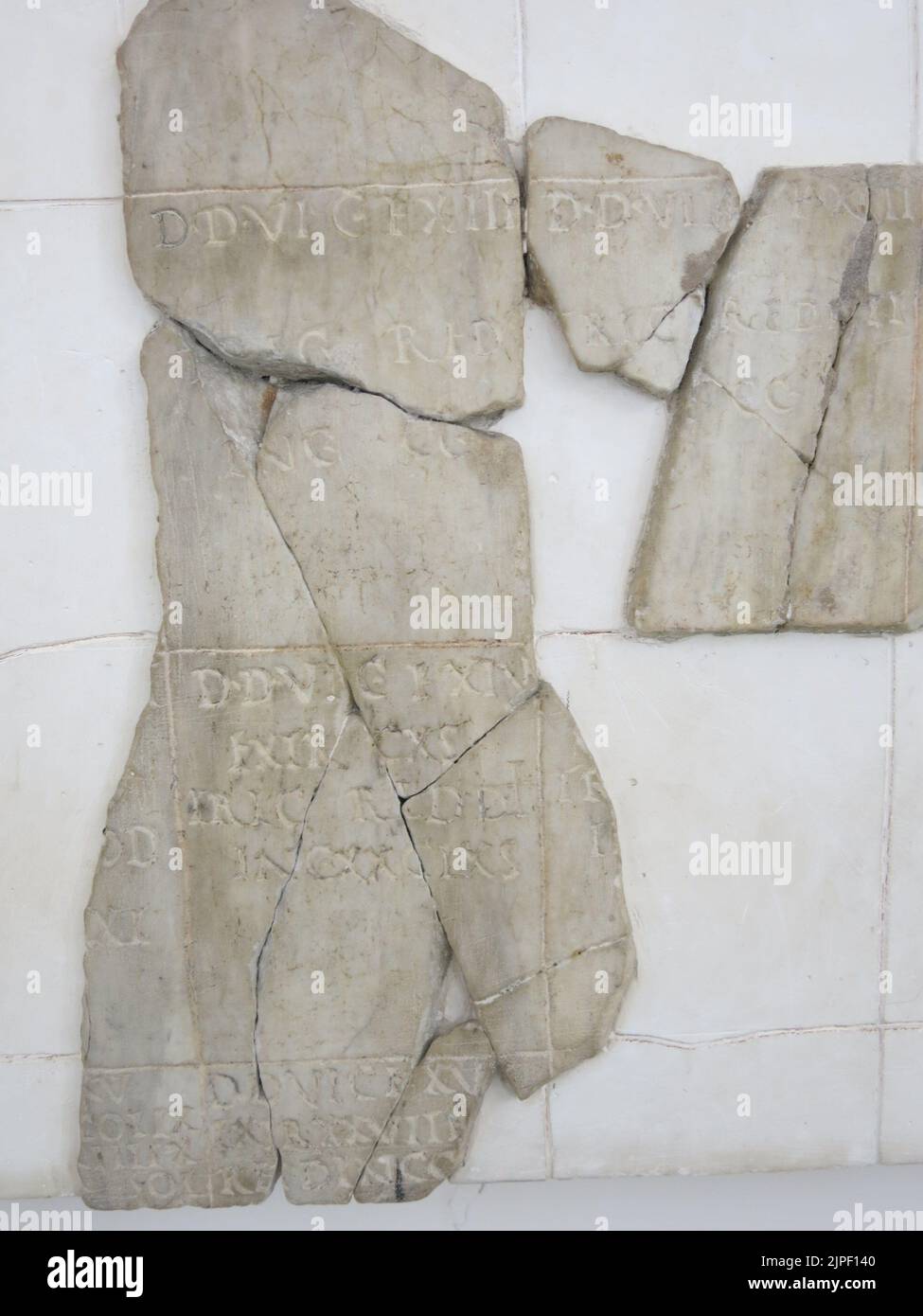 Close-up of some of the white marble fragments dating from 77BC that formed cadestres, or administrative plans from the Roman era in France. Stock Photo