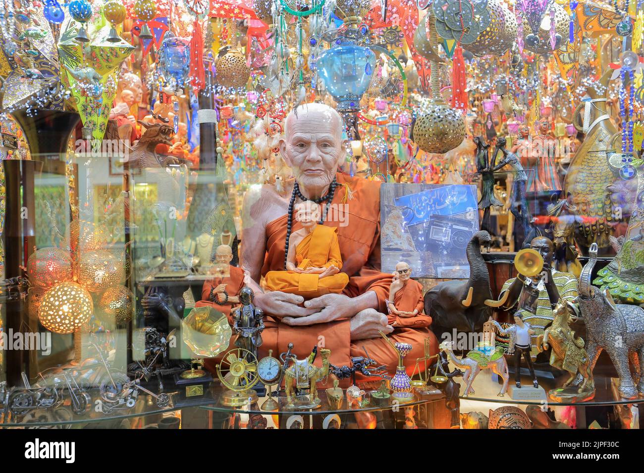 Buddha statue behind glass on the showcase of a souvenir shop in Egypt