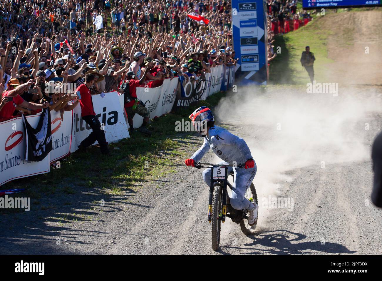 August 06, 2022: Finn Iles of Canada (3) after the finish line looks back at the time clock winning the MenÕs Downhill Final during the 2022 Mercedes-Benz UCI Mountain Bike World Cup held at Mont-Sainte-Anne in Beaupre, Quebec, Canada. Daniel Lea/CSM Stock Photo