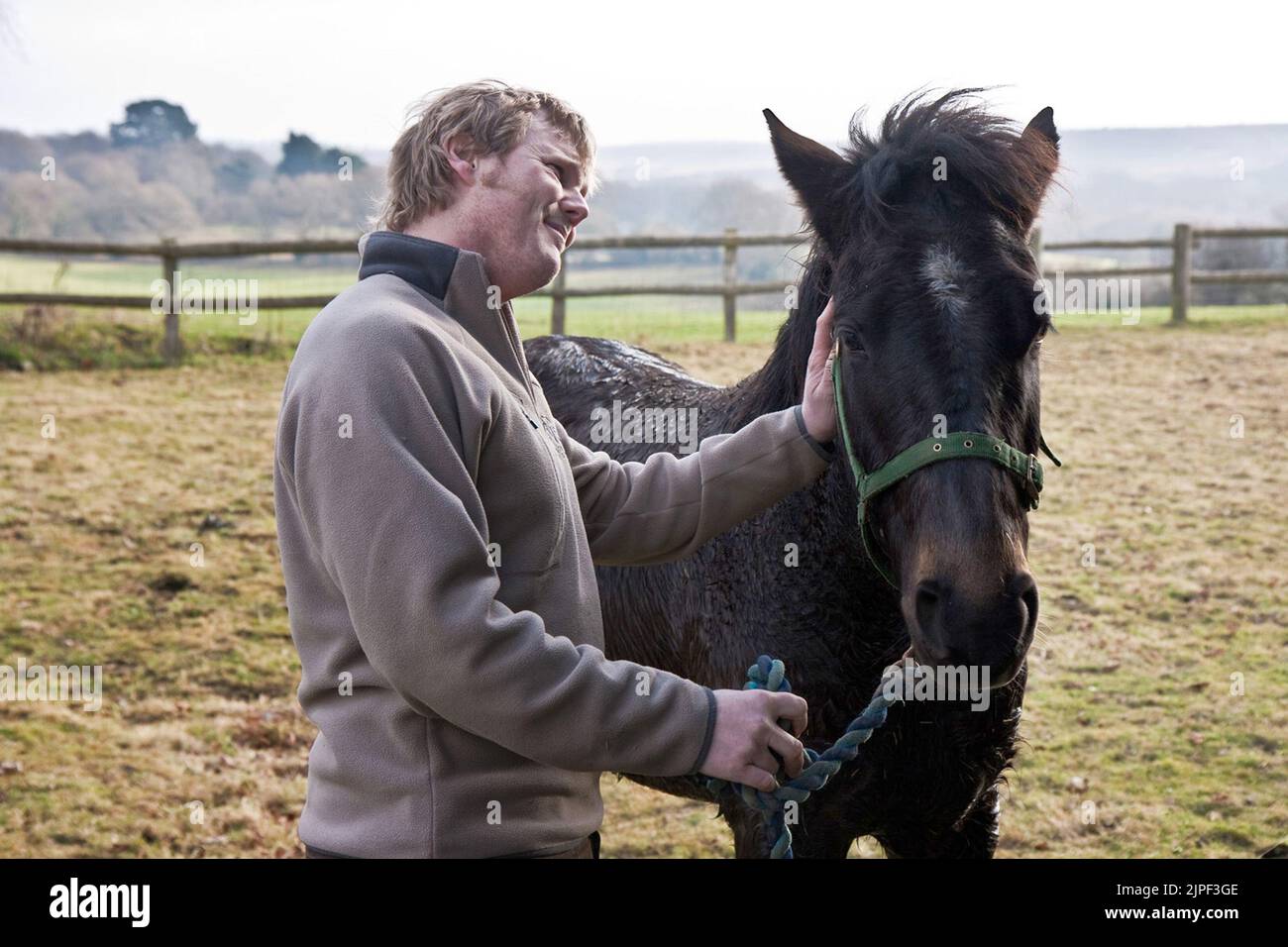 MISCHIEF'S OWNER LUKE GAMBLE WITH THE HORSE AFTER IT WAS RESCUED AFTER GETTING STUCK IN A SWIMMING POOL AT gODSHILL IN THE NEW FOREST. MIKE WALKER PICTURES,2011 Stock Photo