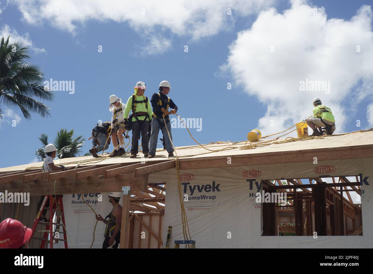 workers installing roof Stock Photo