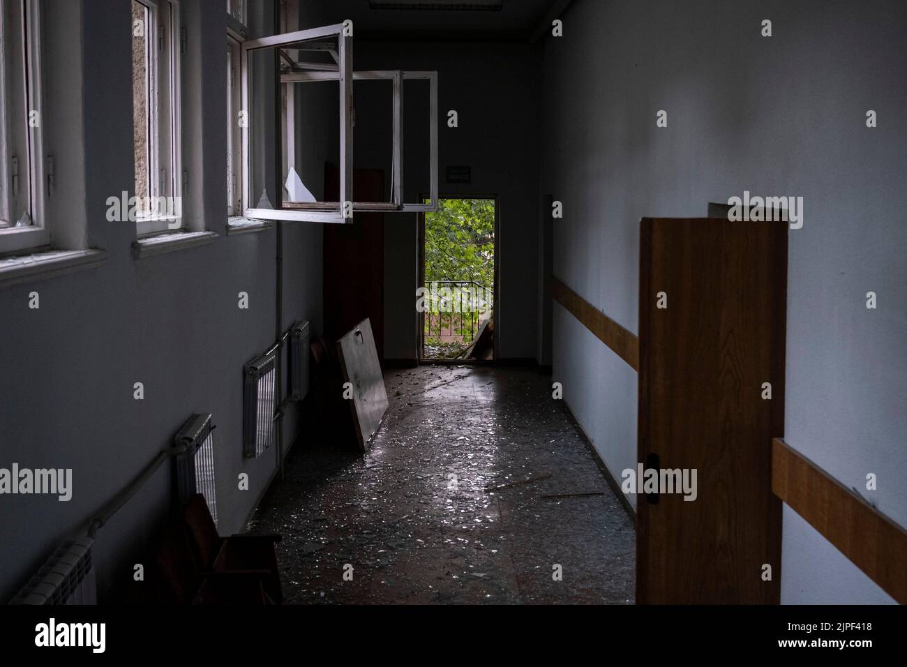 A corridor full of shattered glass on the ground at Petro Mohyla Black Sea National University in Mykolaiv. The university was struck by several Russian shelling at around 1:30 on August 16, as the mayor Oleksandr Sienkevych claimed no one was injured in the shelling. Russia's Ministry of Defense said earlier on social media that the university was a military strategic target with storage of heavy weapons. Stock Photo