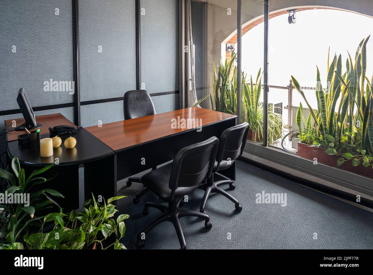 Empty office in a classic style with a large desk and a large window Stock Photo