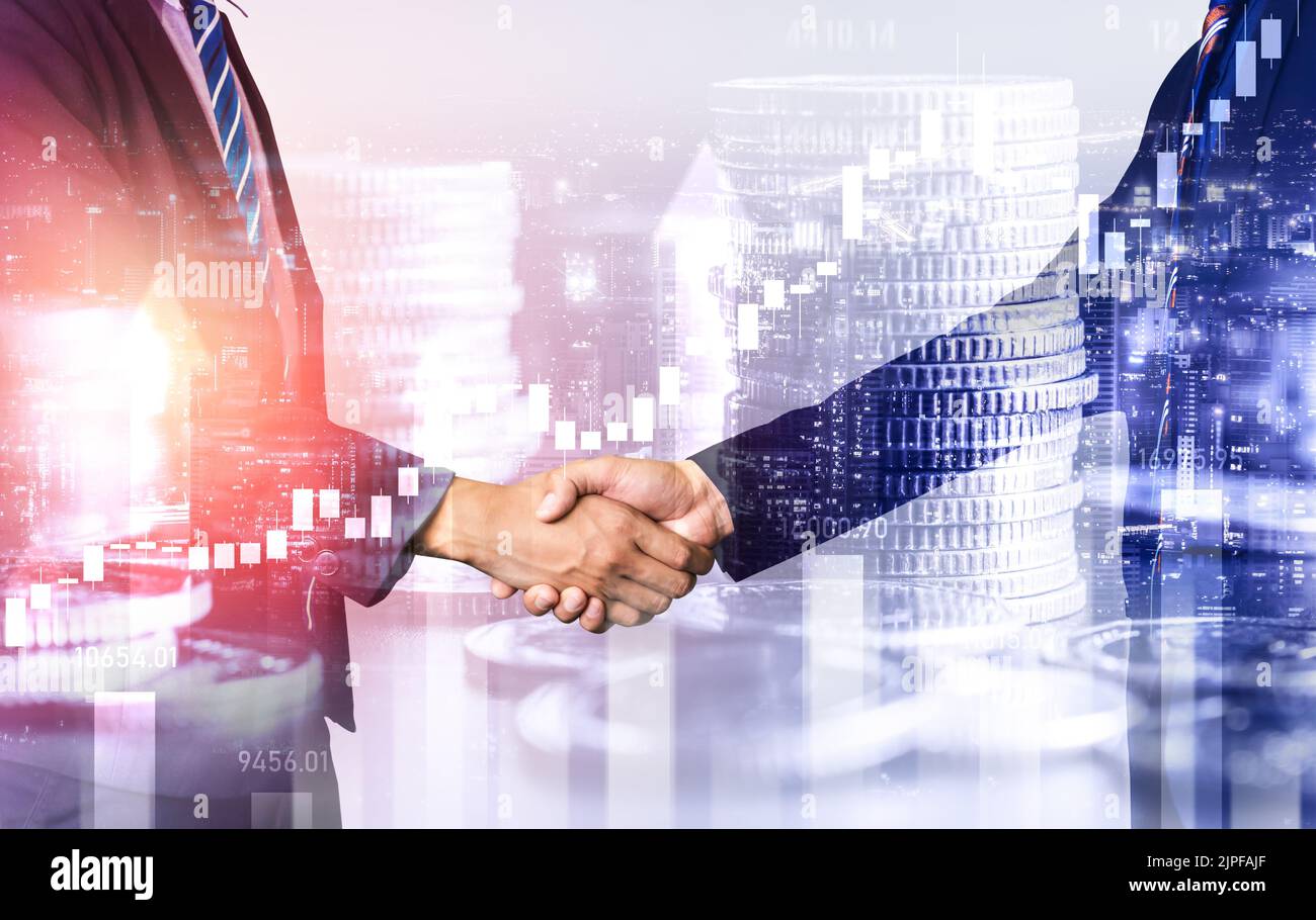 Business handshake on finance prosperity and money technology asset background . Economy and financial growth by investment in valuable stock market Stock Photo