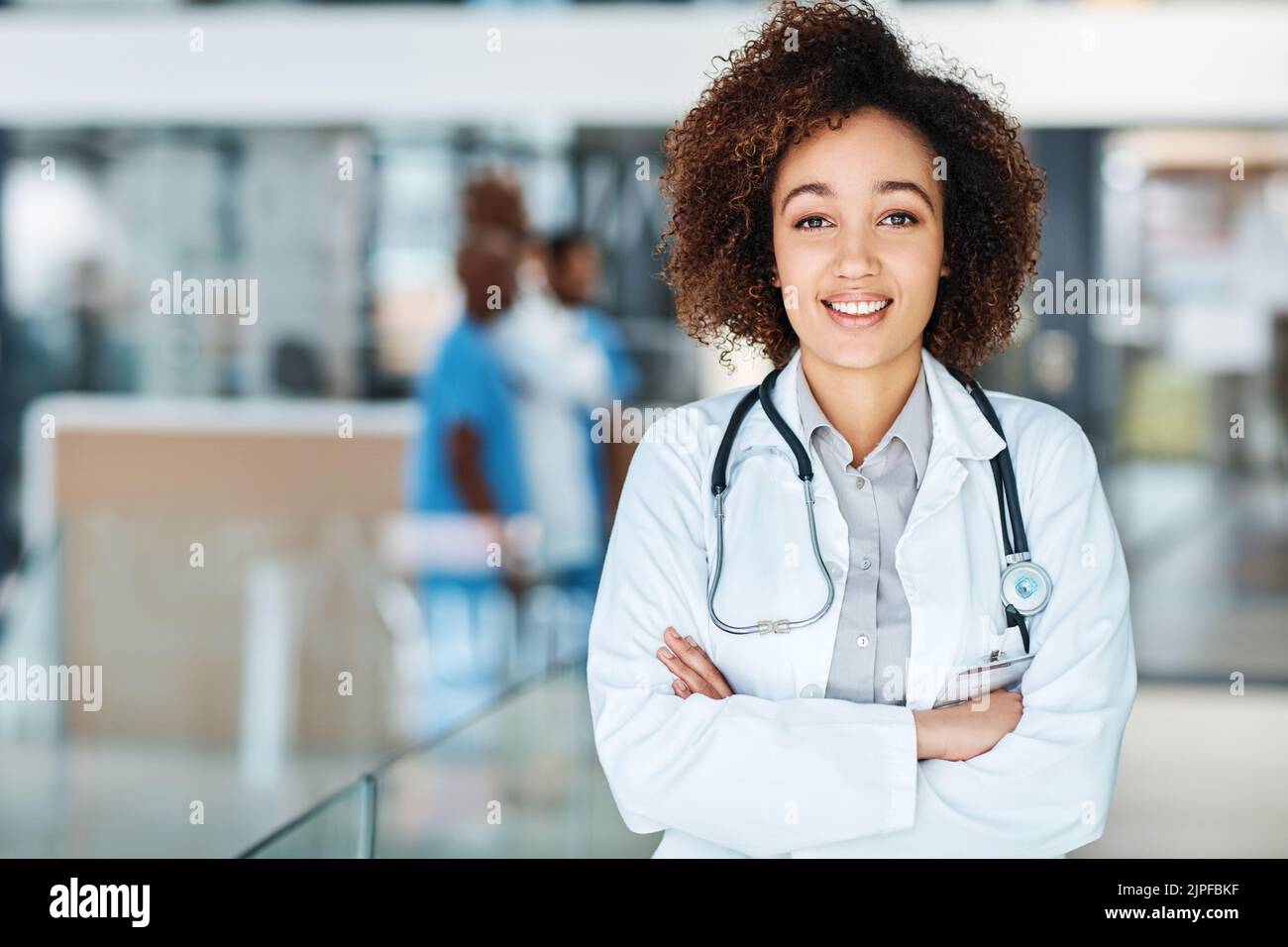 Young doctor standing hi-res stock photography and images - Alamy