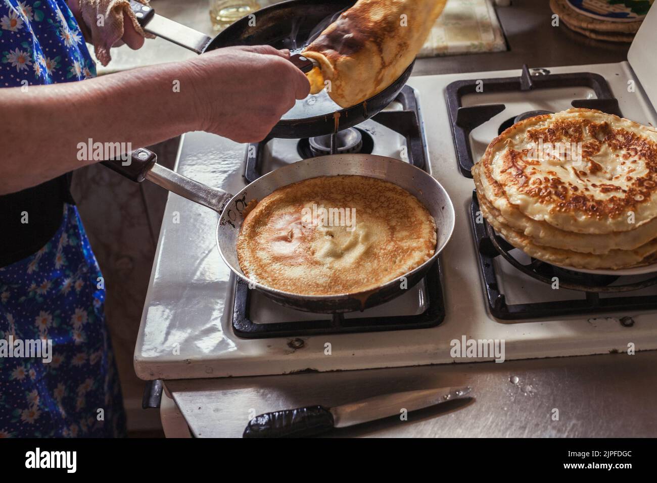 Grandmother making pancakes Stock Photo Alamy