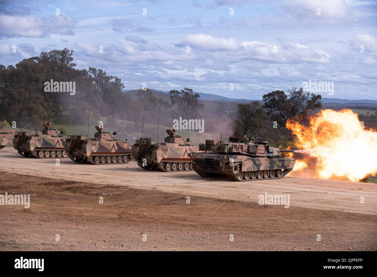 An Abrams tank and armoured personnel carrier fire during an army