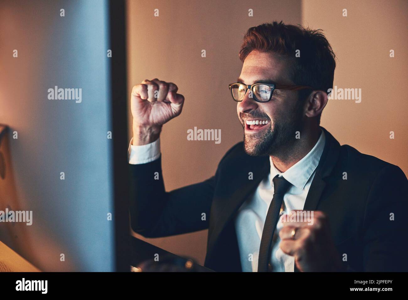 Businessman cheering at office desk hi-res stock photography and images ...
