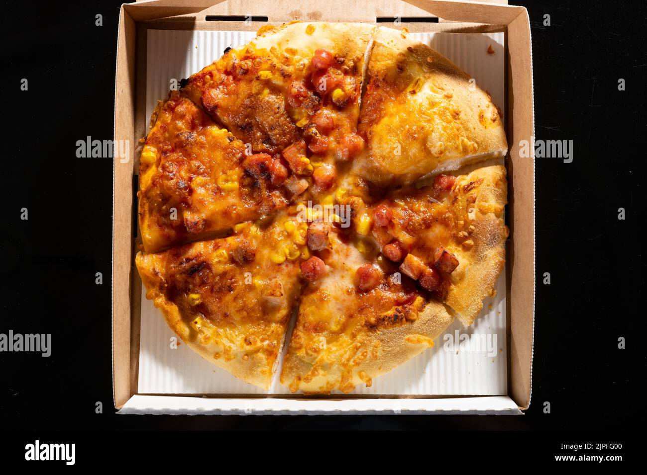 top view fresh pizza with sausages in a box Stock Photo