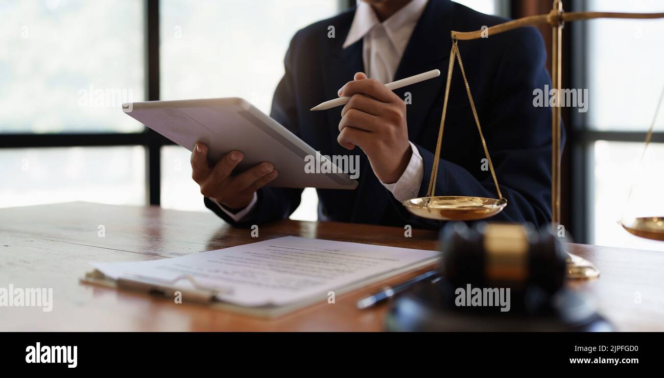 Lawyer working or reading agreement contract in office workplace for