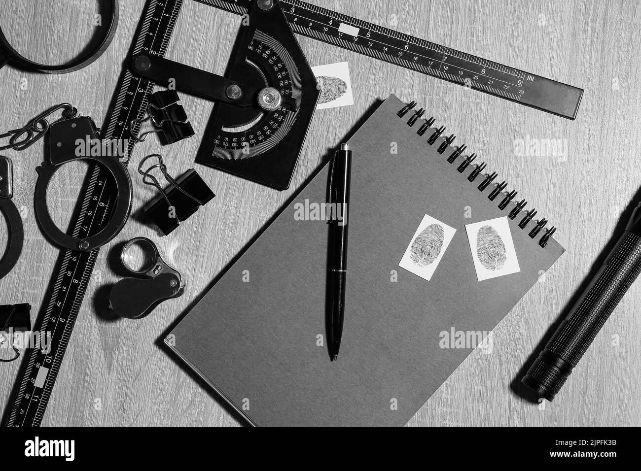 Notebook and accessories of FBI agent on wooden background Stock Photo