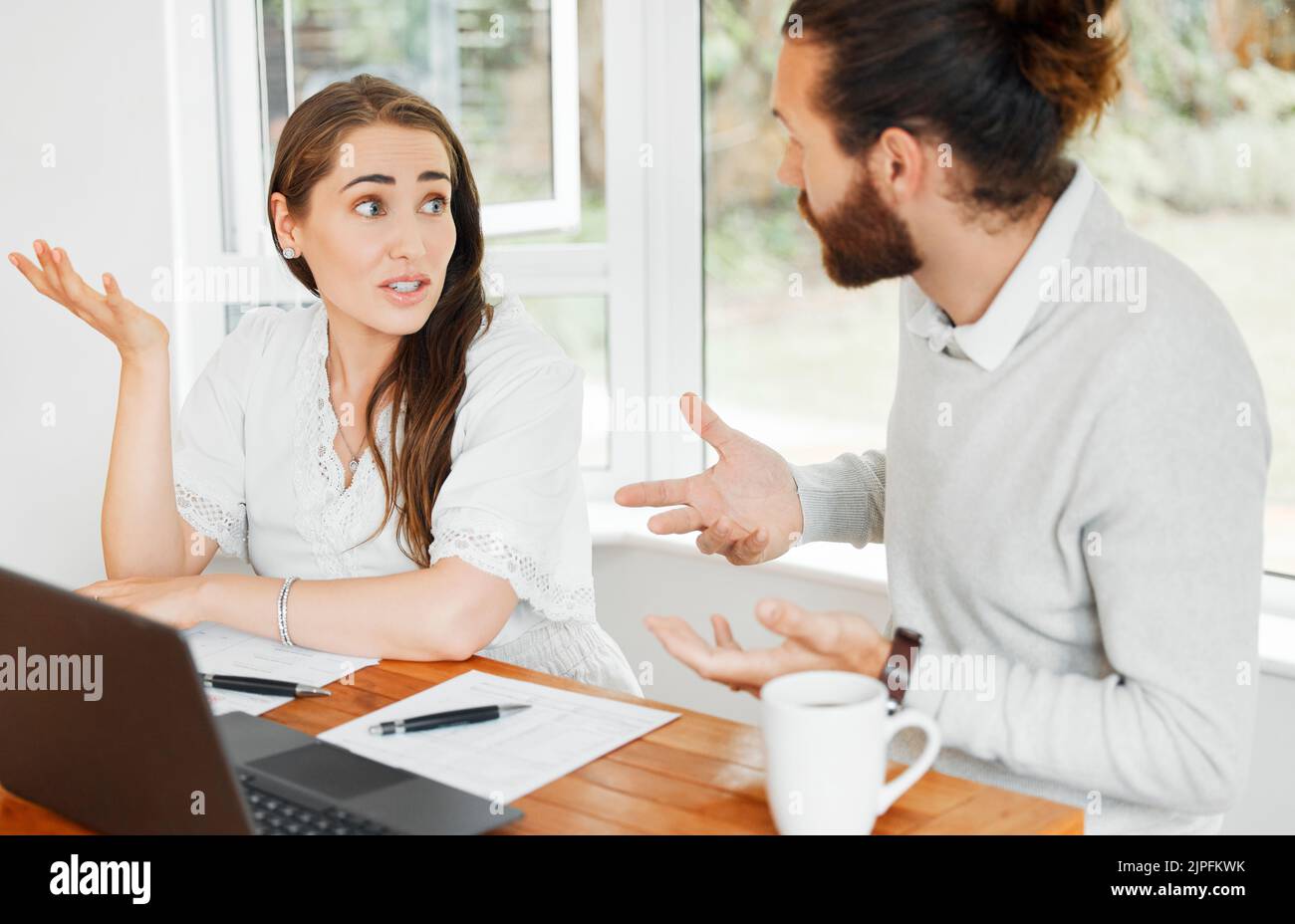 Unhappy, worried and confused couple with idk expression for finance, budget or home loan looking at online bank statement, paper or document. Man and Stock Photo