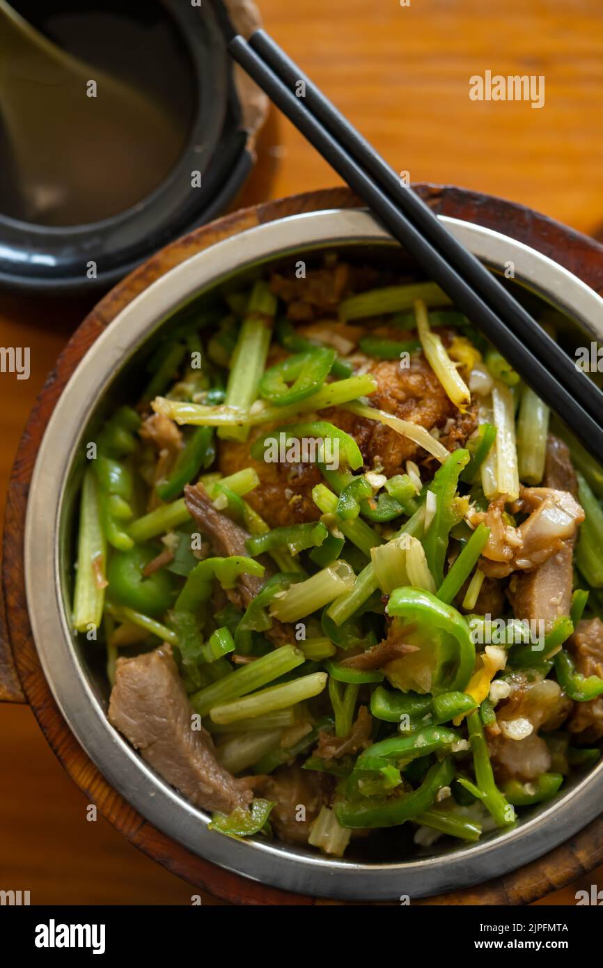 top view fast food of fried pork and fish with celery with bowl of soup vertical composition Stock Photo