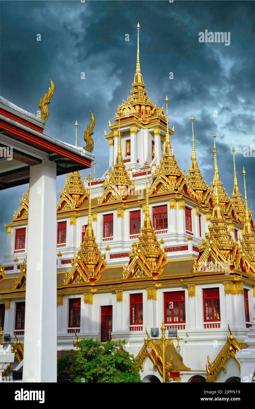 The gold-plated Lohaprasad (tower), based on the architecture of an ancient Buddhist monastery in Sri Lanka; part of Wat Rajanadta,  Bangkok, Thailand Stock Photo