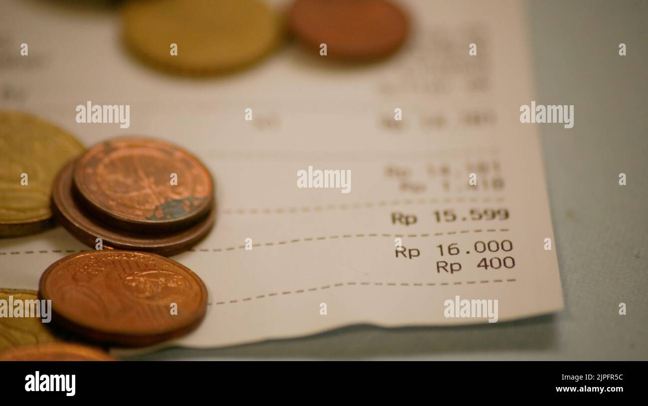 Payment receipt calculation with Indonesia rupiah in dirty table Stock Photo