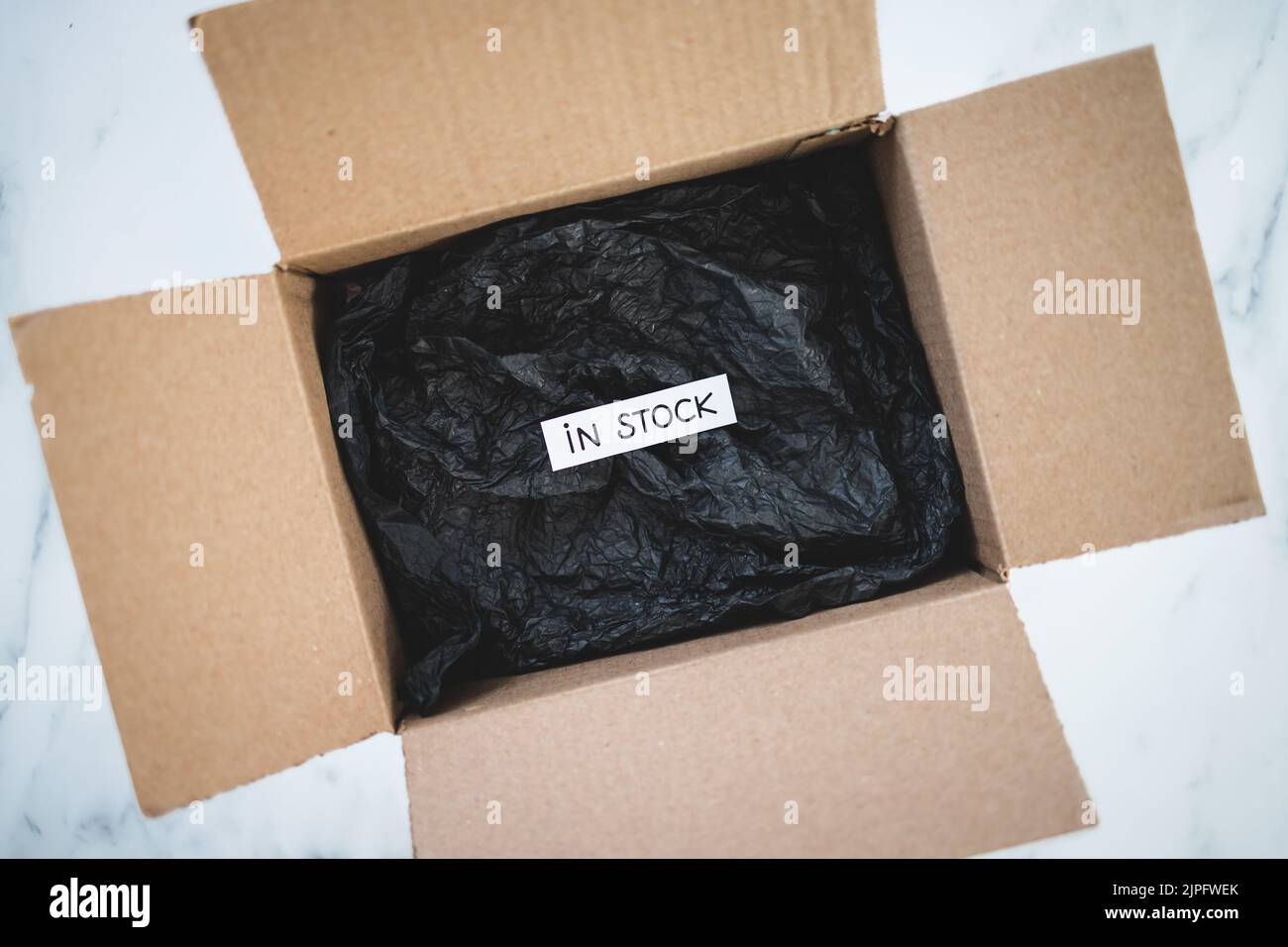 In Stock Text In stock text inside of delivery parcel from online shopping, concept ...